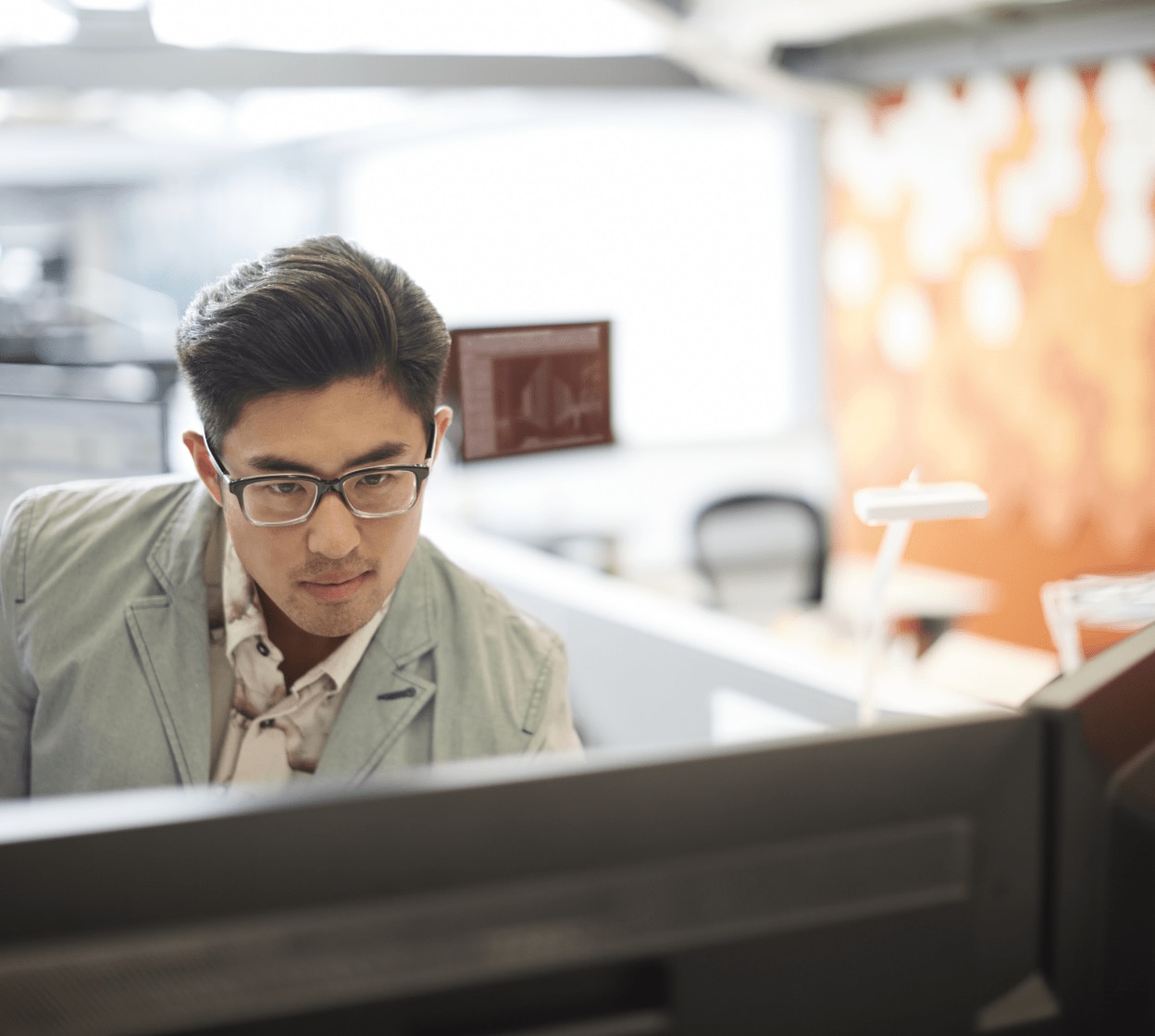 Man working in broadcast on desktop