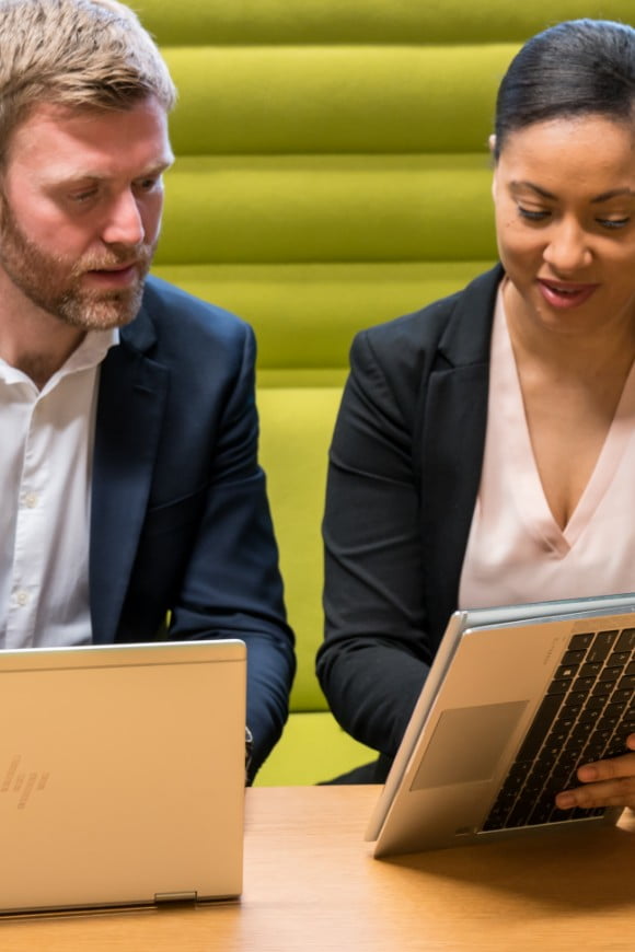 Man using an HP EliteBook x360, aside is a woman using an HP EliteBook x360 in tablet mode
