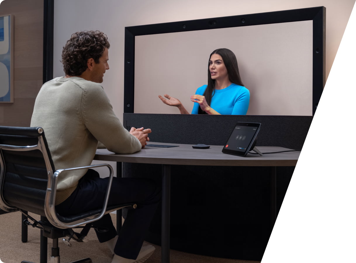 Man on a video conferencing call using HP Dimension with Google Beam