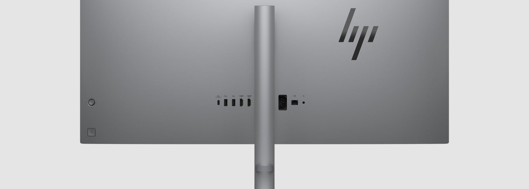 An HP OmniStudio X All-in-One AI PC with a second HP monitor aside