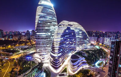Wangjing SOHO, a complex of three curvilinear asymmetric skyscrapers in Wangjing in Beijing, China. Designed by Iraqi architect Zaha Hadid.