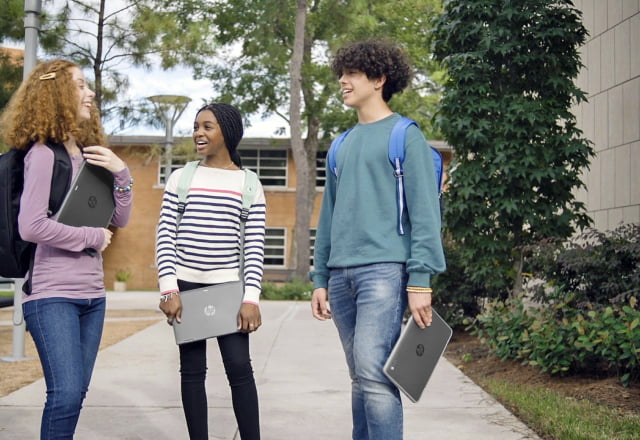 Student on school campus with HP laptops