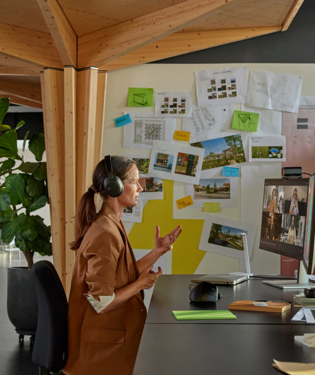 Woman at desk in office on video call