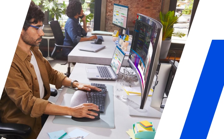 Person working with a desktop computer in an office