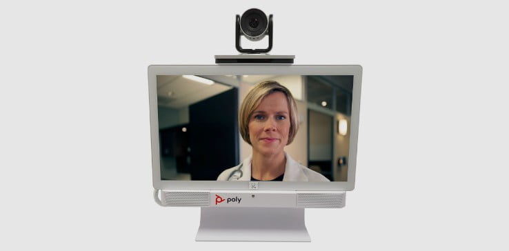Poly telehealth video conferencing station with EagleEye IV camera atop monitor screen