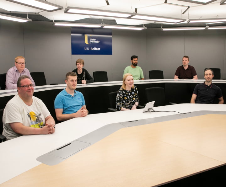 Ulster University employees in an HP-enabled conference room
